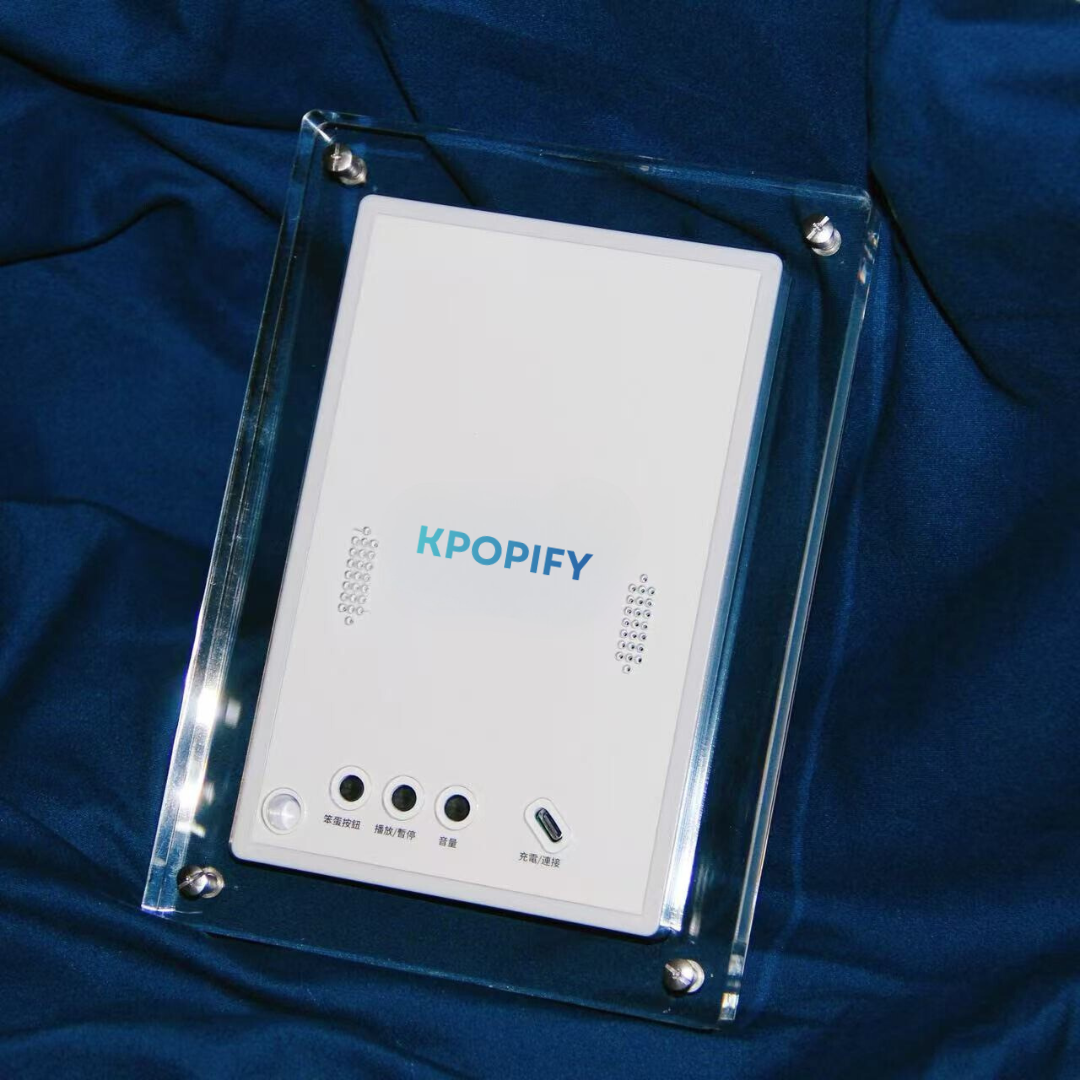 KPOPIFY Poster K-pop video frame, back view in clear acrylic case on blue fabric