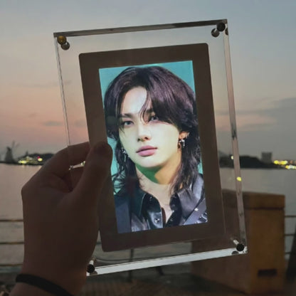 Video: KPOPIFY Poster playing a K-pop idol clip in its clear acrylic frame at dusk
